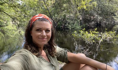 Savannah smiling on the banks of the Sopchoppy River